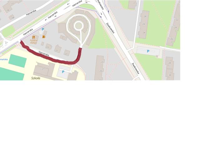 Uszkodzona nawierzchnia drogi ulicy Harcerskiej